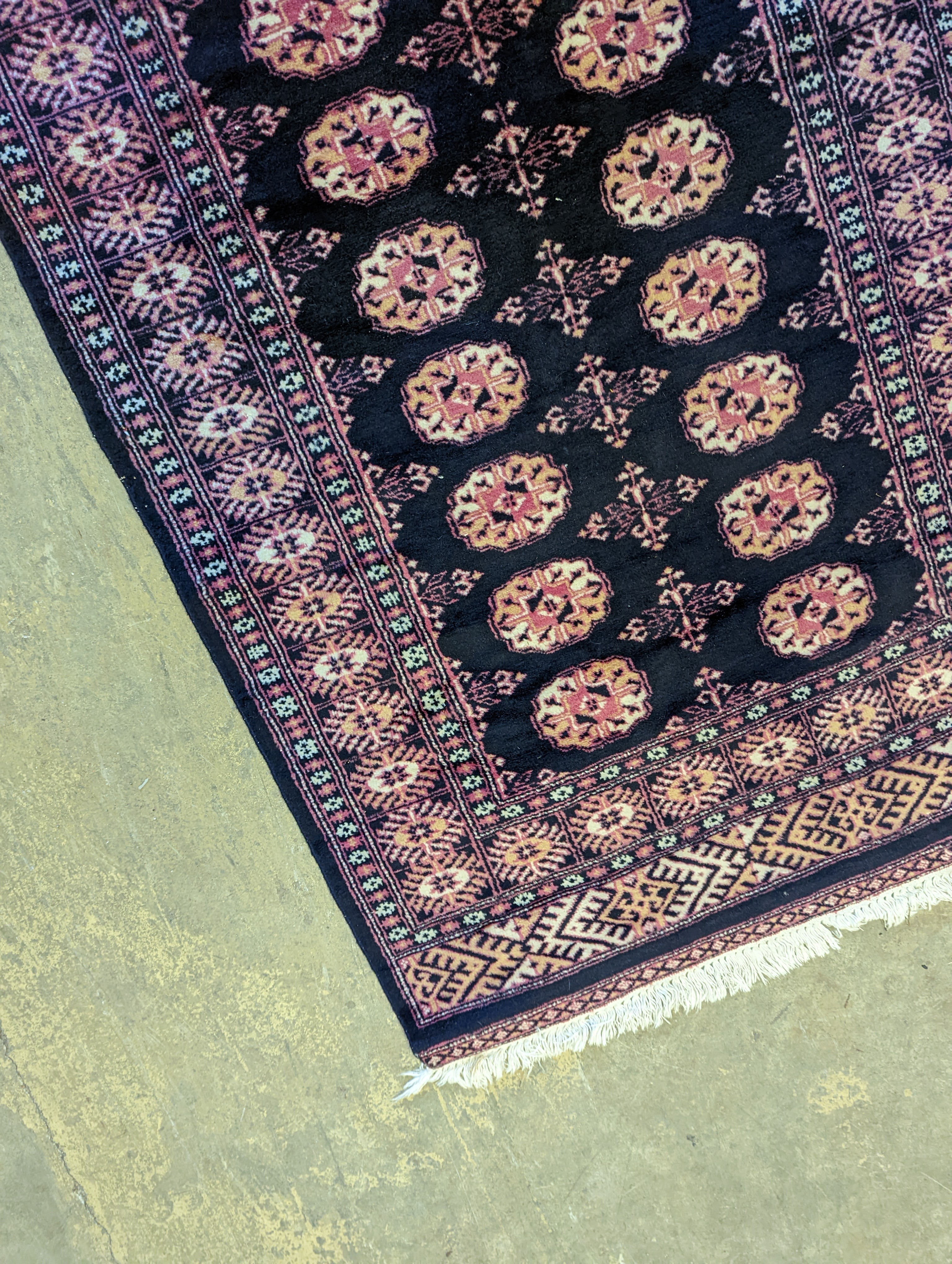 A Bokhara design blue ground rug, 160 x 98cm